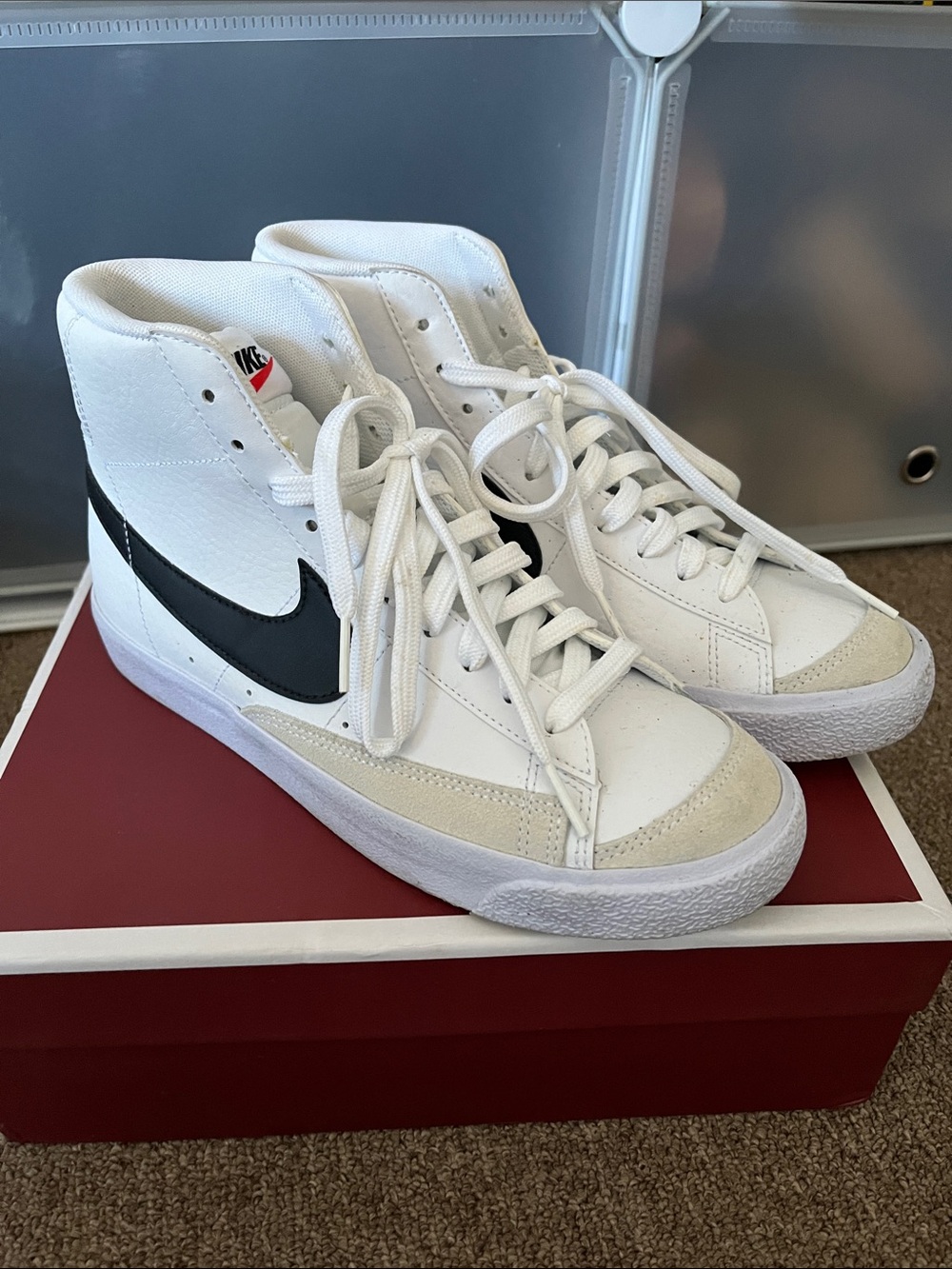 Nike White High-Top Sneakers with Black Swoosh